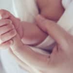 41731859 – soft focus and blurry of baby hands vintage style color effect