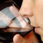 Generic red wine in glass being tasted by Amy Wilson Client: Al